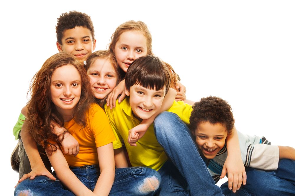 Group of hugging and laughing kids